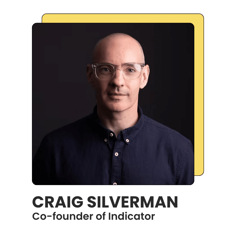 Portrait of Craig Silverman, Co-founder of Indicator, wearing clear glasses and a dark button-up shirt, in front of a dark background.